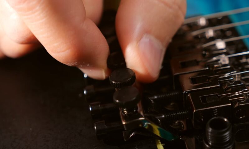 Close up photo of a guitar tuning