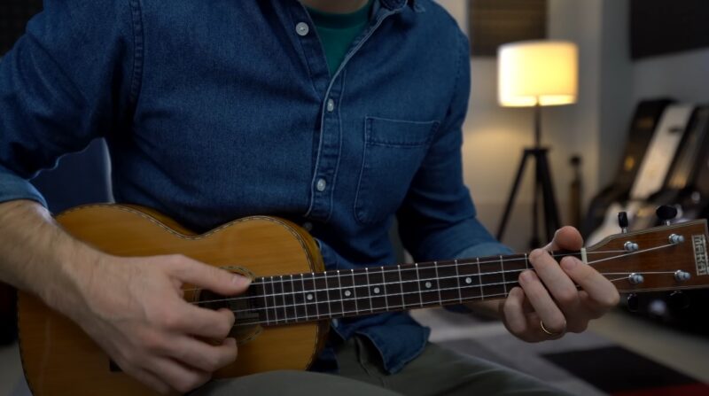 Man plays ukulele