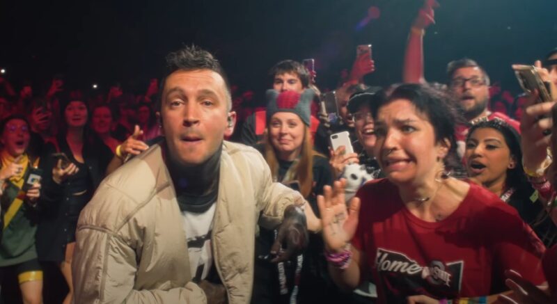 Fans' faces light up with joy during a 21 Pilots concert