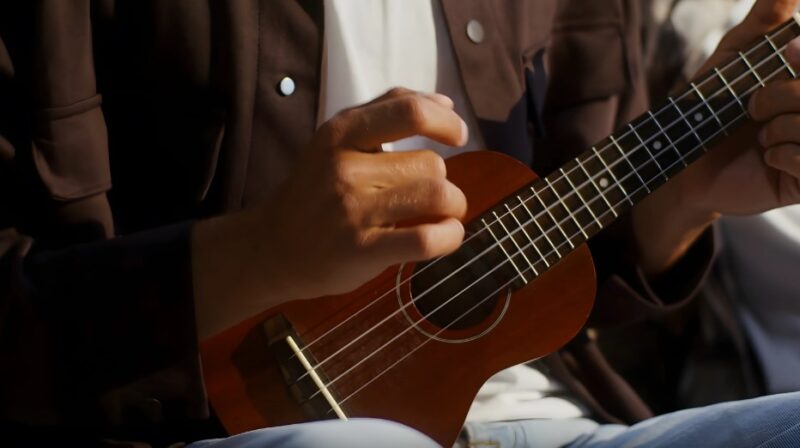 Close-up of hands playing a ukulele