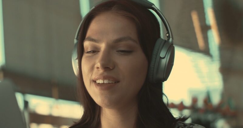 Relief on a girl's face while listening to music on her headphones