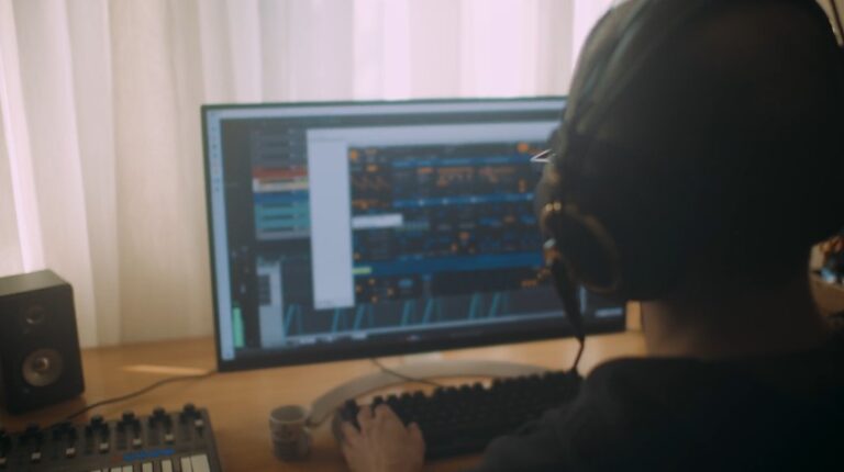 A sound engineer immersed in a digital audio workstation