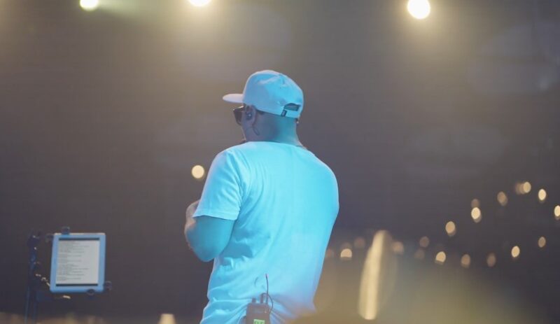 A singer on the concert, pictured from the back