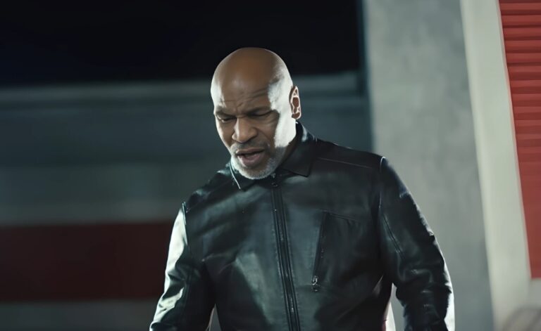 A man in a dark leather jacket