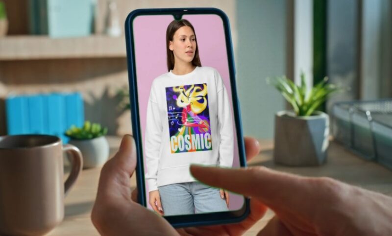 A person views a graphic sweatshirt online