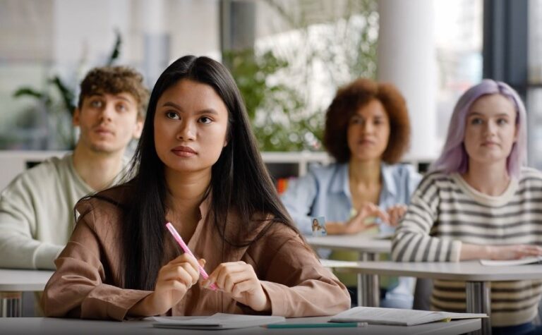 Focused students in a classroom setting, absorbing knowledge