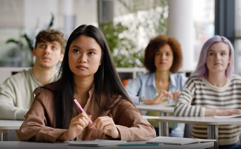 Focused students in a classroom setting, absorbing knowledge