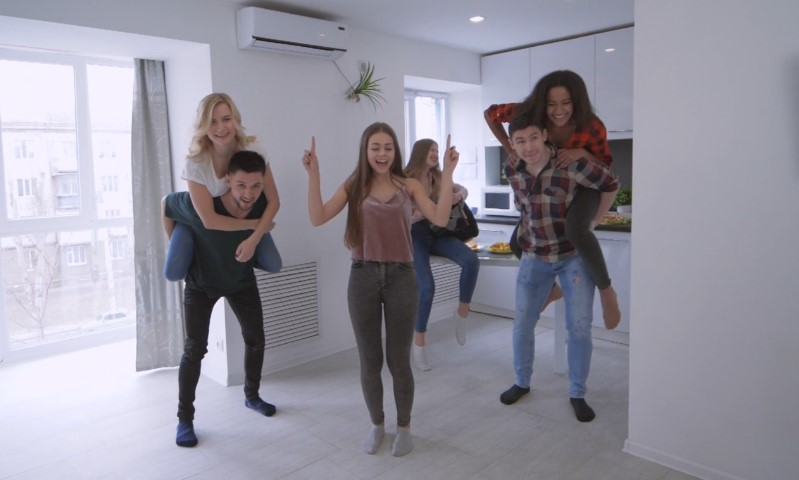 Friends goofing around in a living room