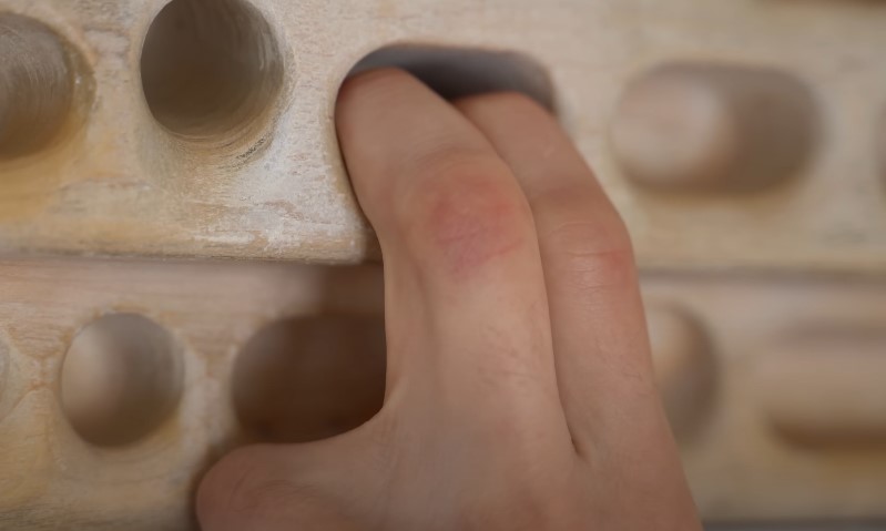 Finger exercise using a wooden board